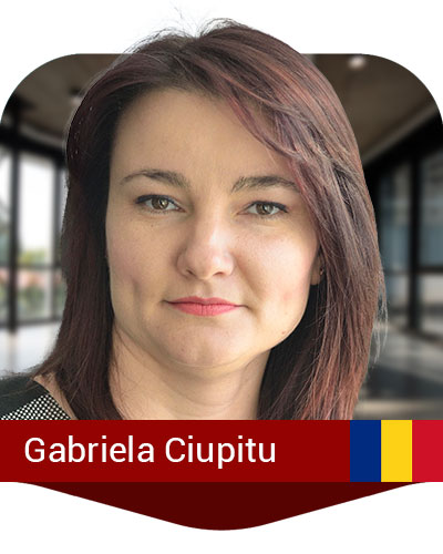 A woman with straight brown hair and a neutral expression is shown in a professional indoor setting. The name "Gabriela Ciupitu" and a Romanian flag appear at the bottom of the image.