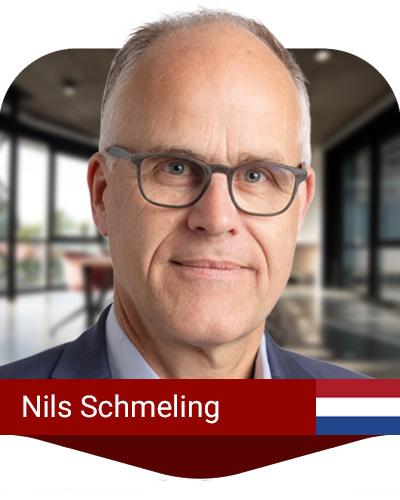 A middle-aged man with glasses and short gray hair in a suit, posing indoors. A red name banner reads “Nils Schmeling” with a small Dutch flag on the right.